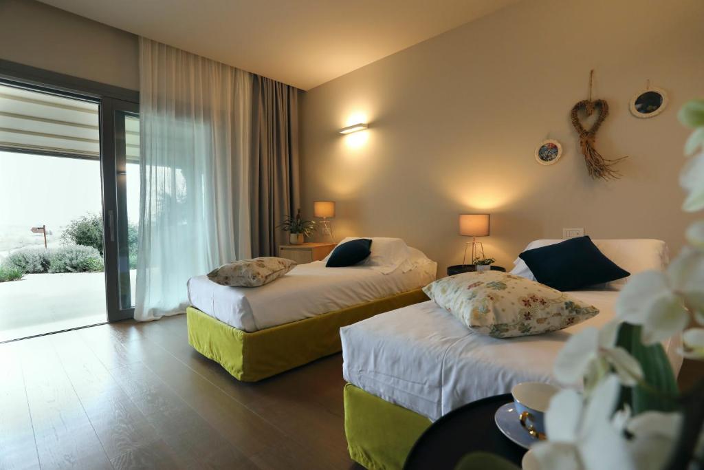 Postel nebo postele na pokoji v ubytování Agriturismo Le Piccole Macìe
