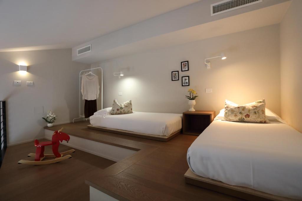 Postel nebo postele na pokoji v ubytování Agriturismo Le Piccole Macìe
