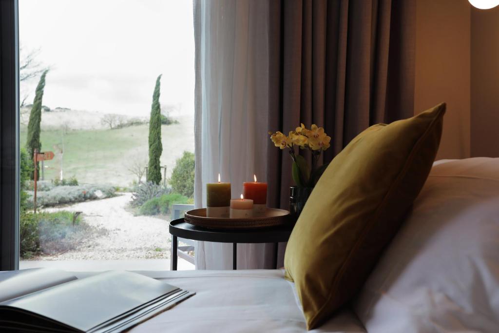 Postel nebo postele na pokoji v ubytování Agriturismo Le Piccole Macìe