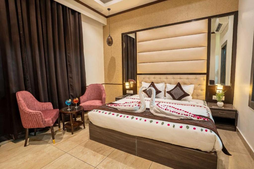 Posteľ alebo postele v izbe v ubytovaní Flagship Hotel Saffron