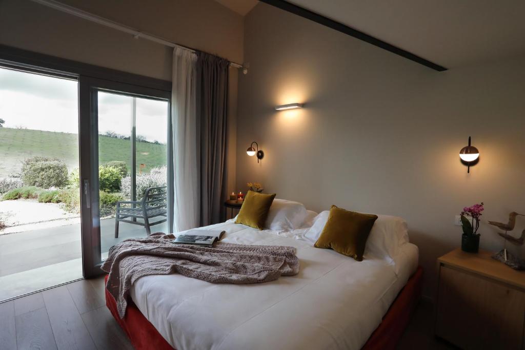 Postel nebo postele na pokoji v ubytování Agriturismo Le Piccole Macìe
