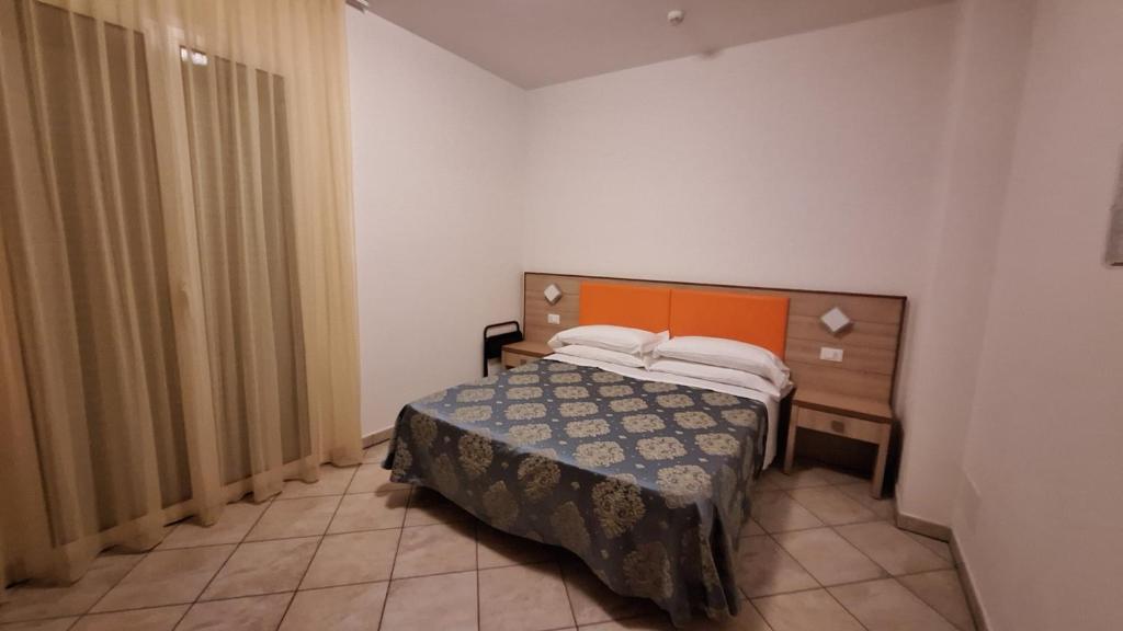 Postel nebo postele na pokoji v ubytování Hotel Massimo