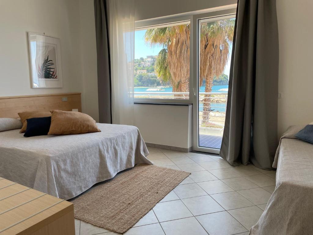 Postel nebo postele na pokoji v ubytování Hotel Mare