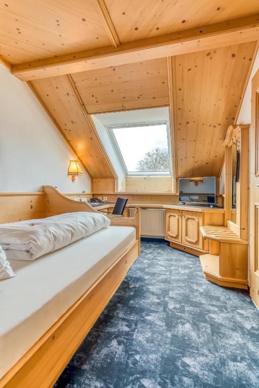 Postel nebo postele na pokoji v ubytování Ringhotel Forellenhof