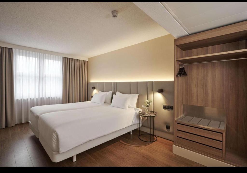 Una cama o camas en una habitación de East İstanbul Airport Hotels & Free Transportation