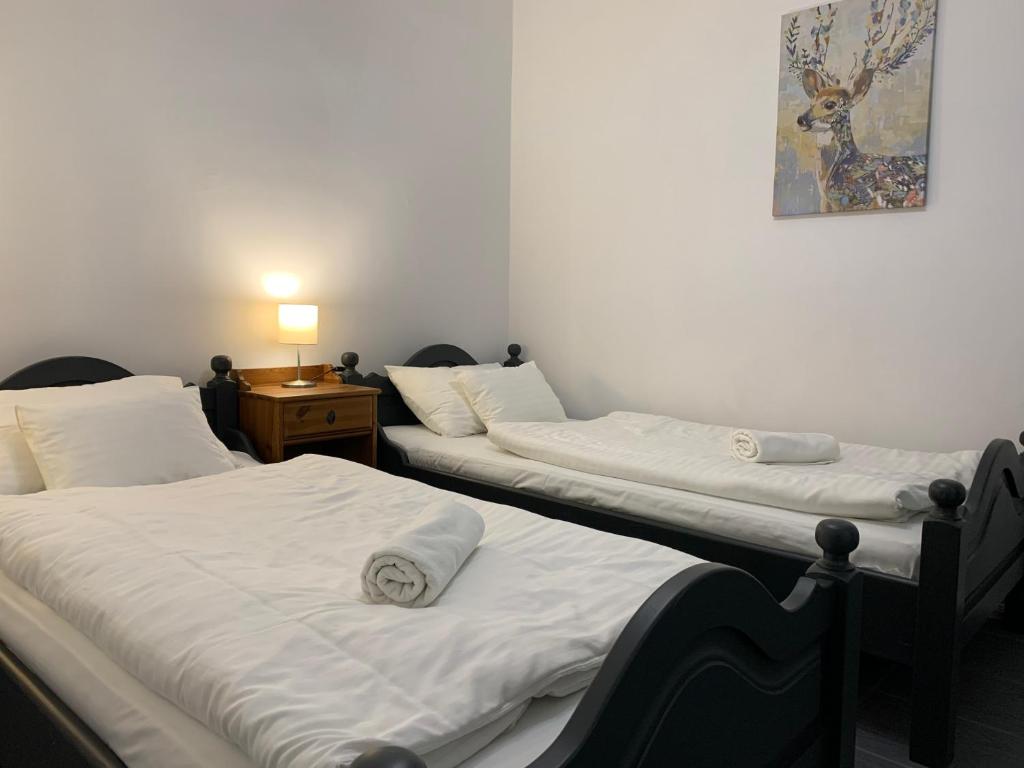 Posteľ alebo postele v izbe v ubytovaní MiLLER's Inn Panzió és Étterem