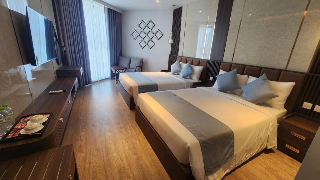 Ένα ή περισσότερα κρεβάτια σε δωμάτιο στο Apec Mandala Condotel Mũi Né