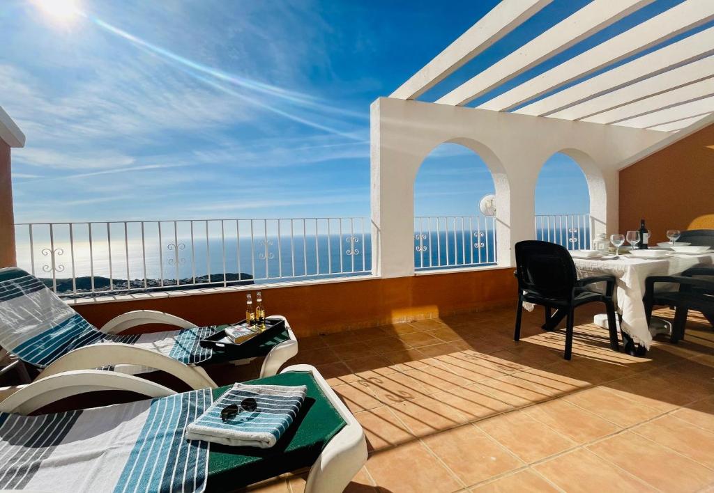 a room with a balcony with a view of the ocean at MirAzul in Cumbre del Sol