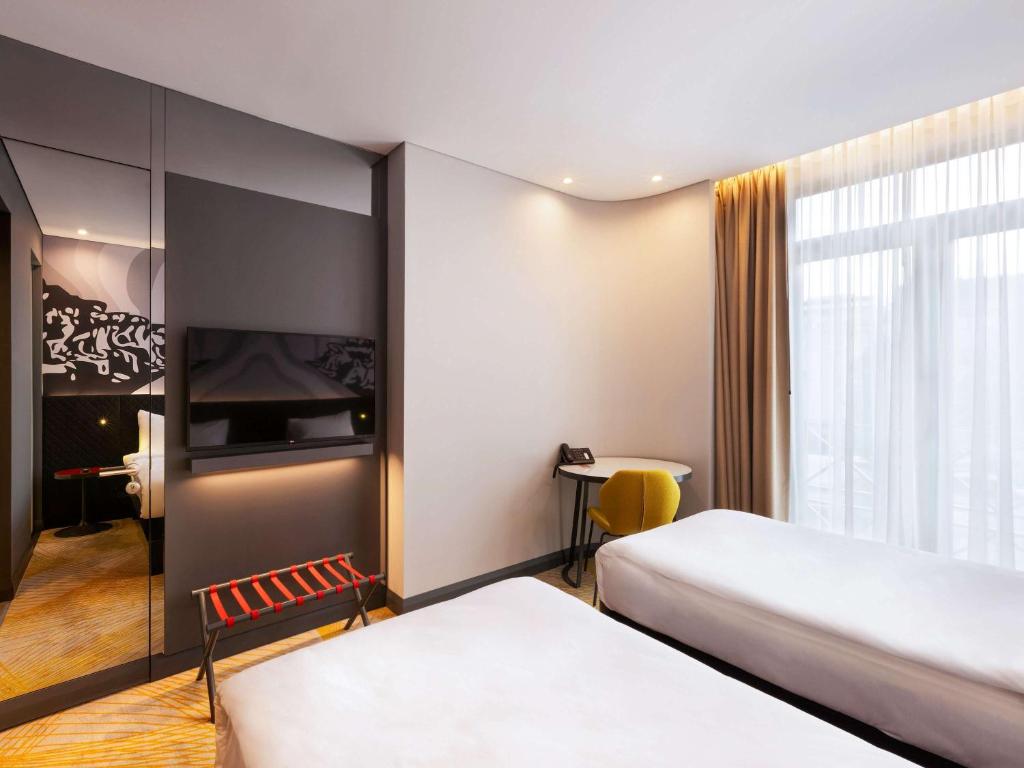 A bed or beds in a room at ibis Styles Istanbul Merter