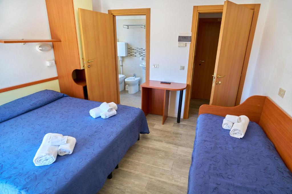 Postel nebo postele na pokoji v ubytování Nuovo hotel ANTHISA