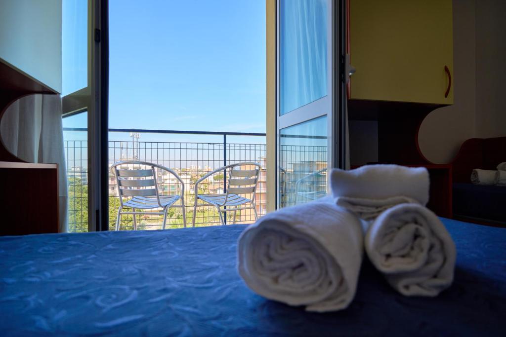 Postel nebo postele na pokoji v ubytování Nuovo hotel ANTHISA
