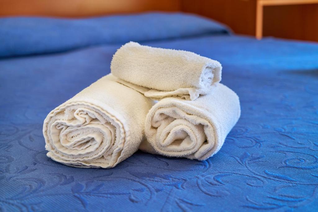 Postel nebo postele na pokoji v ubytování Nuovo hotel ANTHISA