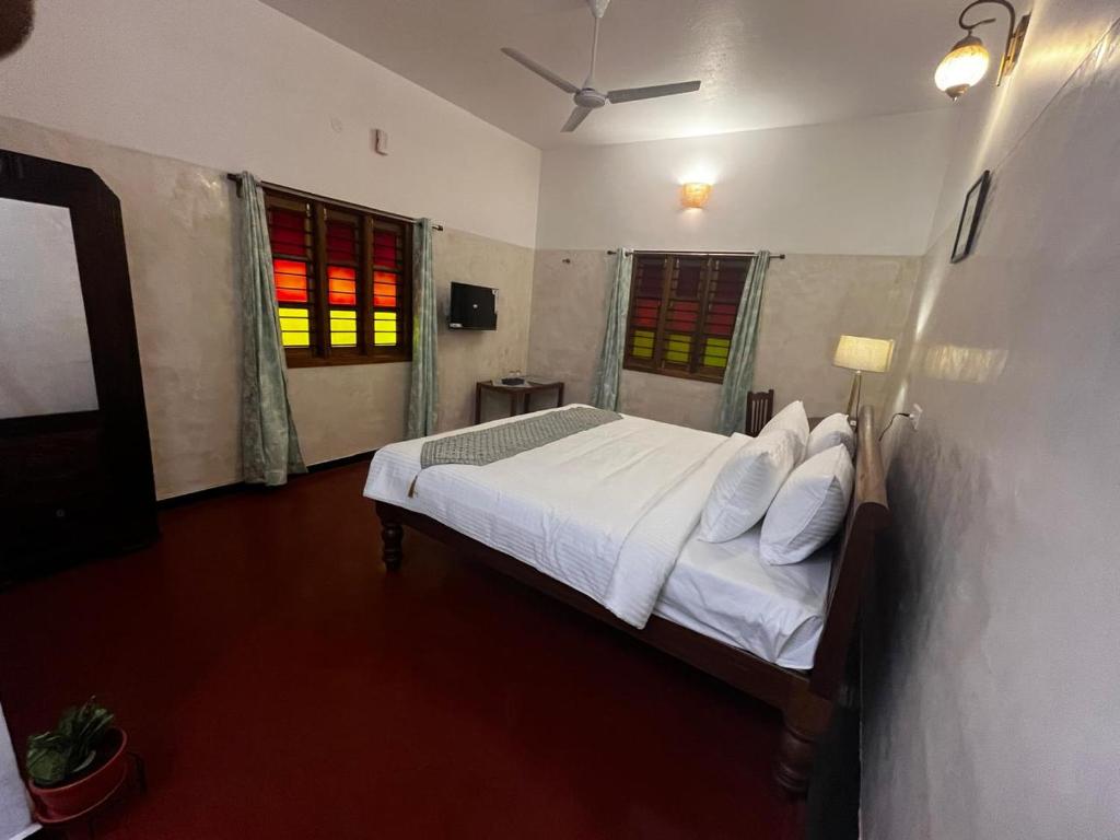 Postel nebo postele na pokoji v ubytování Villa Vedapuri