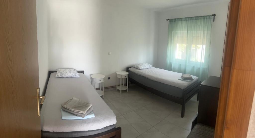 Posteľ alebo postele v izbe v ubytovaní Apartments Nicole Wera