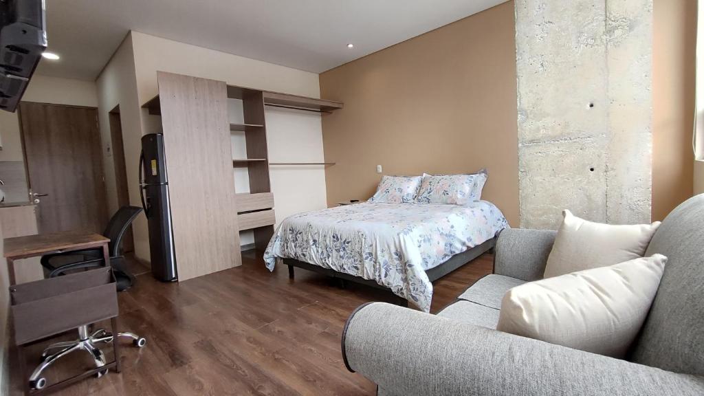 Postel nebo postele na pokoji v ubytování La Milla, Lofts