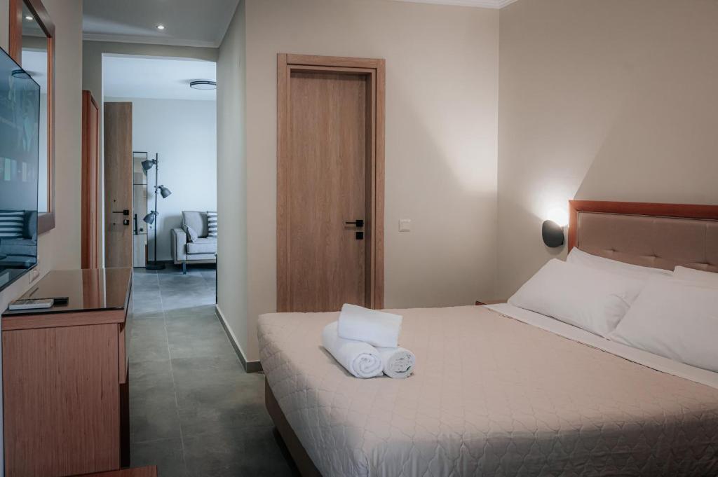 Postel nebo postele na pokoji v ubytování Hotel Hermes Pieria