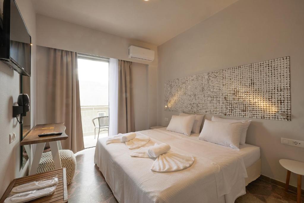 Кровать или кровати в номере CICADA HOTEL