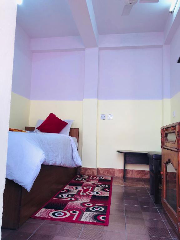 Postel nebo postele na pokoji v ubytování Yeti Cozy Hotel
