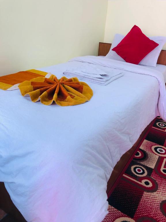 Postel nebo postele na pokoji v ubytování Yeti Cozy Hotel