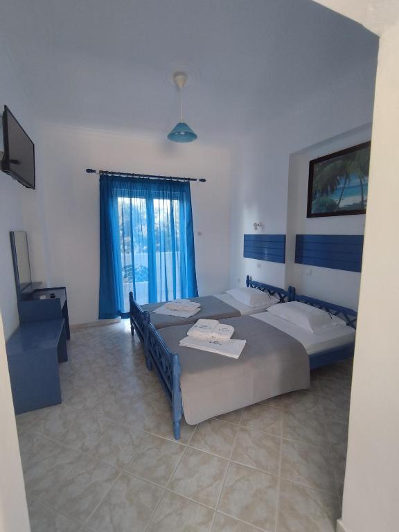 Postel nebo postele na pokoji v ubytování VILLA AGIA AIKATERINI