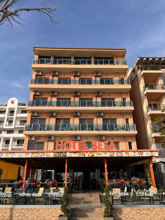 a hotel with a sign on the front of it at Hotel Besa in Shëngjin