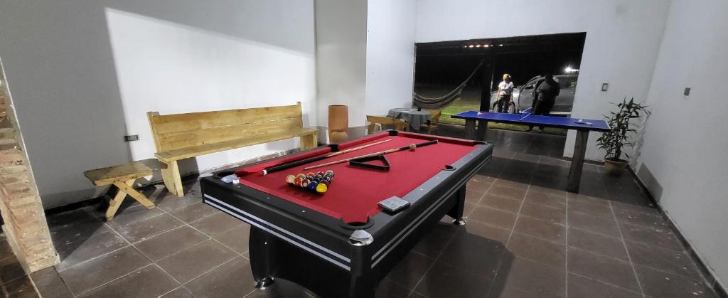 a room with a ping pong table and a pool table at Hotel campestre santa rita 