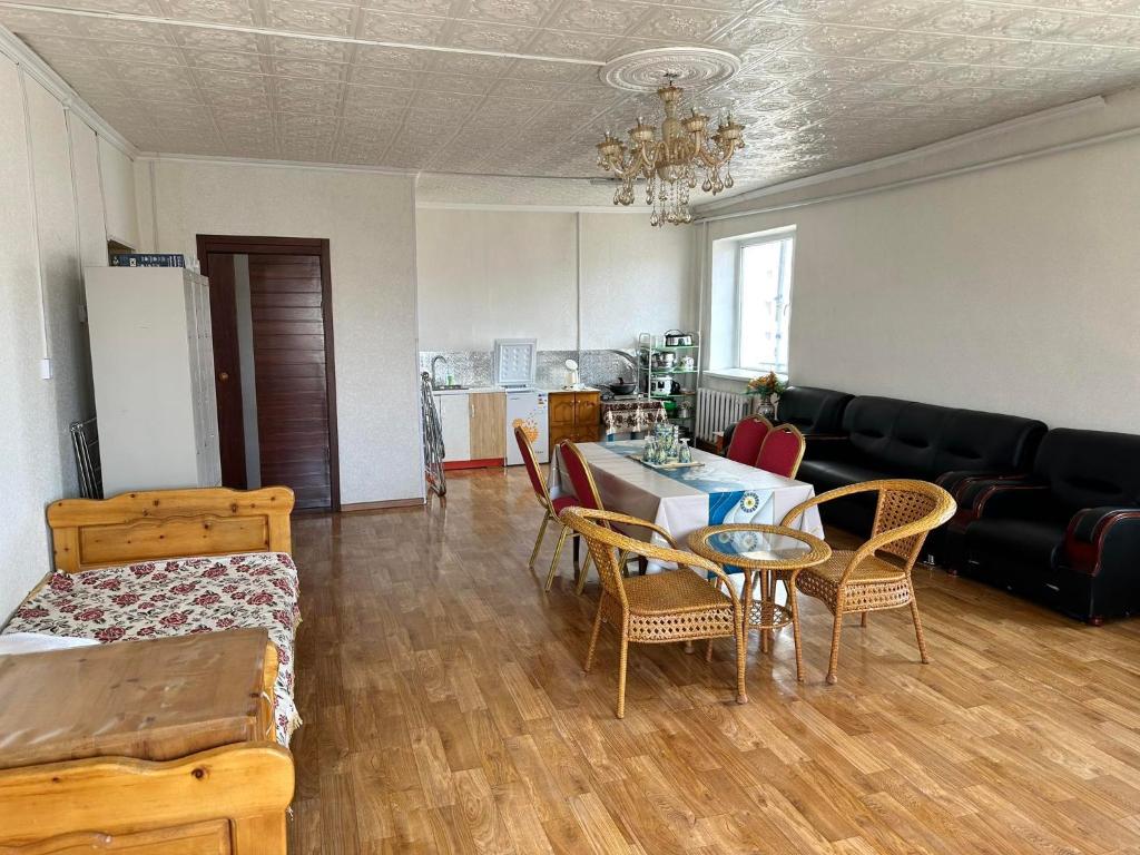 a living room with a table and chairs and a couch at Selenge in Mörön