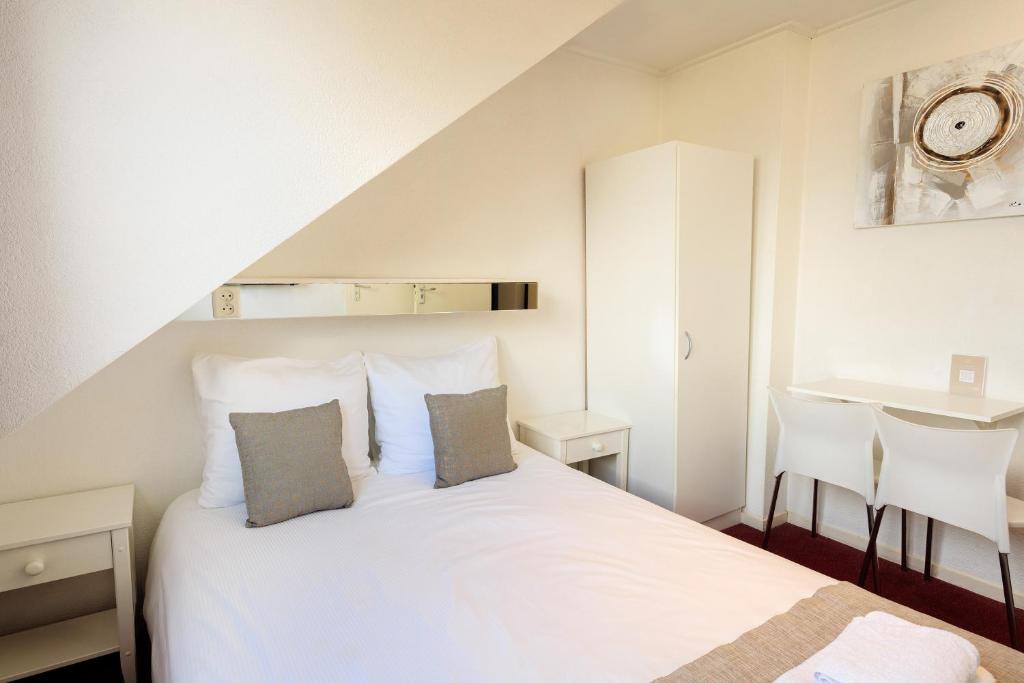Postel nebo postele na pokoji v ubytování Hotel Berg en Bos