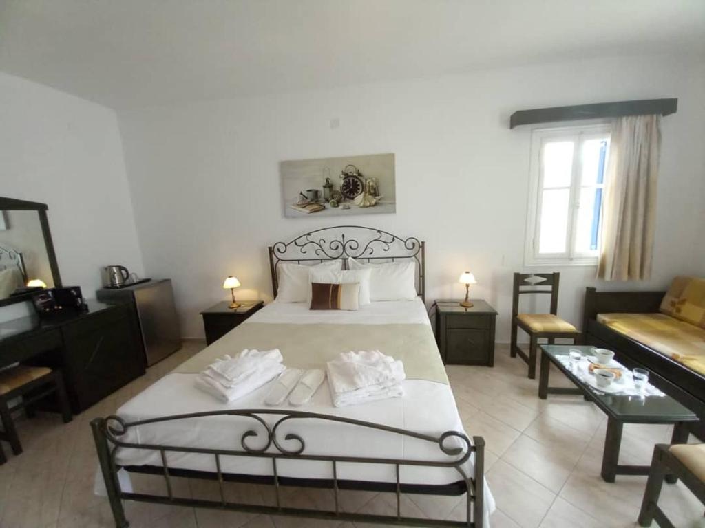 Postel nebo postele na pokoji v ubytování Venikouas Hotel