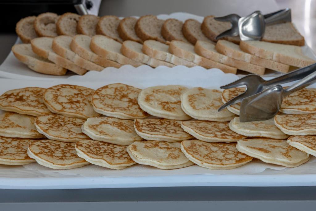a pile of bread and crackers on a plate at Hotel Continental in Caorle