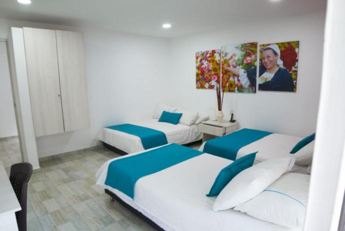 Postel nebo postele na pokoji v ubytování Almaviva Casa Hotel