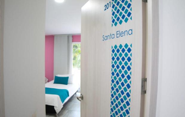 Postel nebo postele na pokoji v ubytování Almaviva Casa Hotel