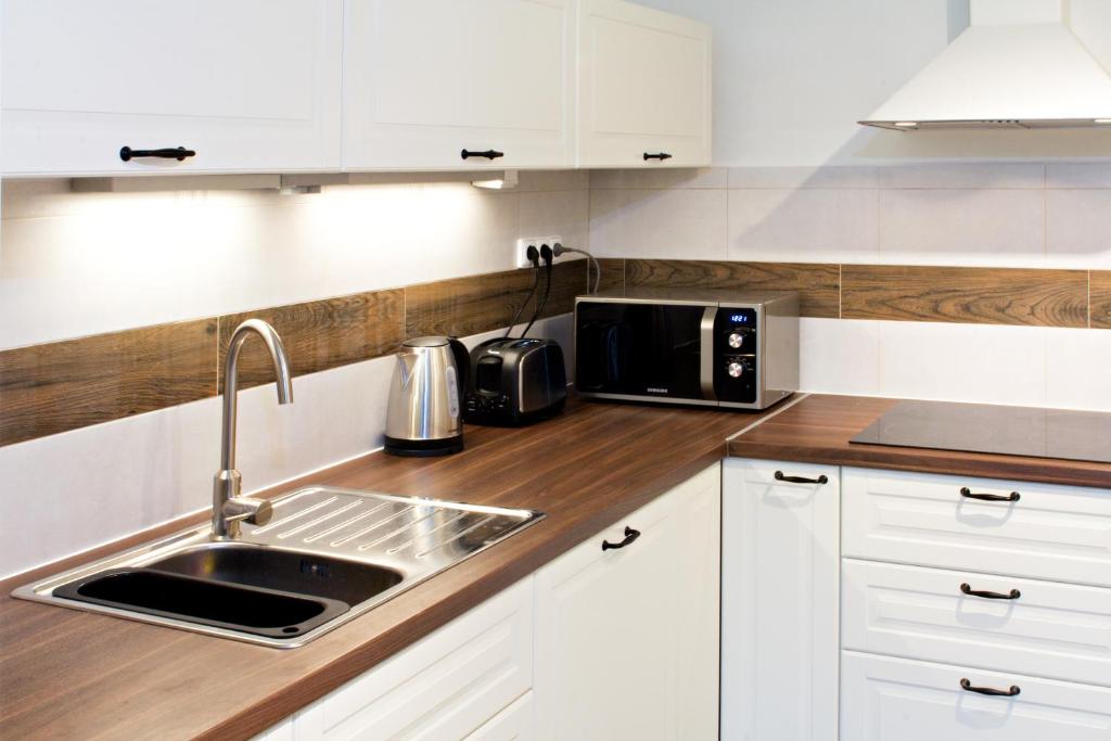 Kuchyň nebo kuchyňský kout v ubytování Apartmány Chata Švadlenka
