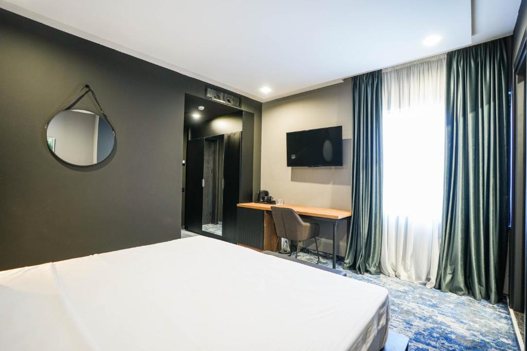 Postel nebo postele na pokoji v ubytování Hotel Splendid Tbilisi