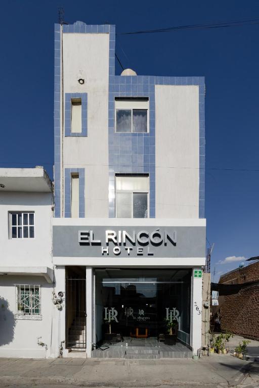 a building with a sign that reads el rijken at Hotel El Rincón in San Francisco del Rincón