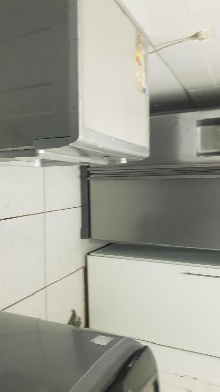 a car parked in a kitchen with a microwave at Multiplex with a view in Durban