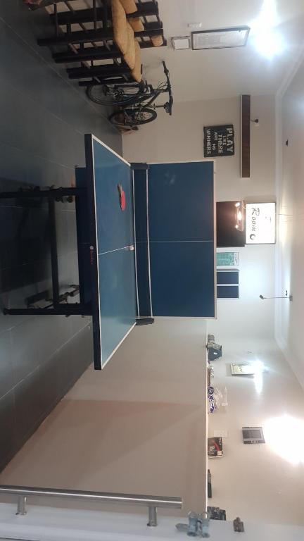 a kitchen with a large blue refrigerator in a room at Multiplex with a view in Durban