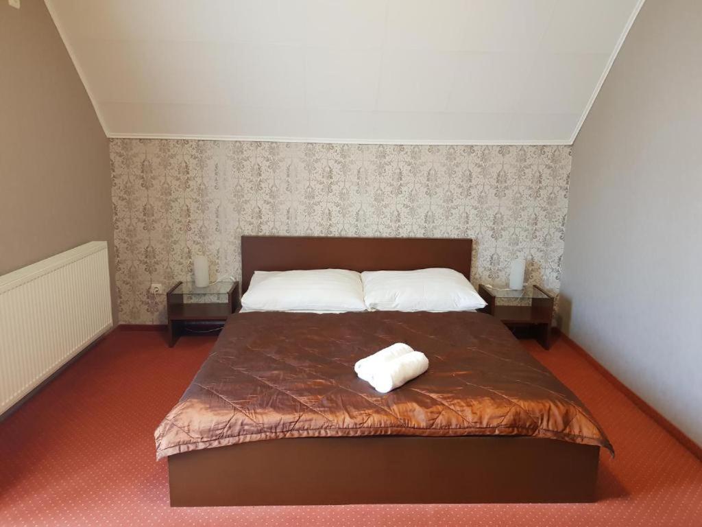 Postel nebo postele na pokoji v ubytování Amaretto Szállás