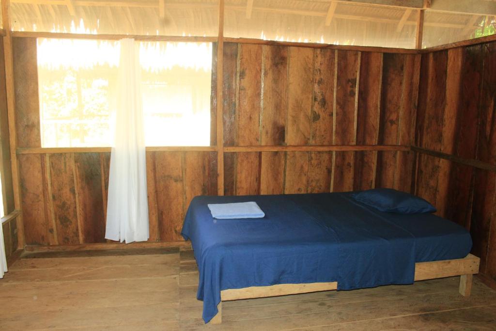 Postel nebo postele na pokoji v ubytování Macaw Adventures Lodge