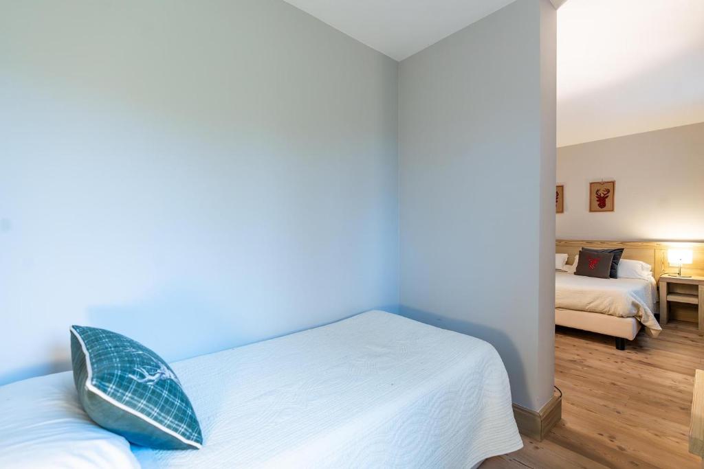 Łóżko lub łóżka w pokoju w obiekcie ACCADEMIA VINE LODGE
