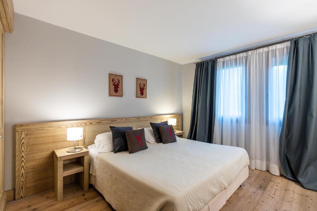 Łóżko lub łóżka w pokoju w obiekcie ACCADEMIA VINE LODGE