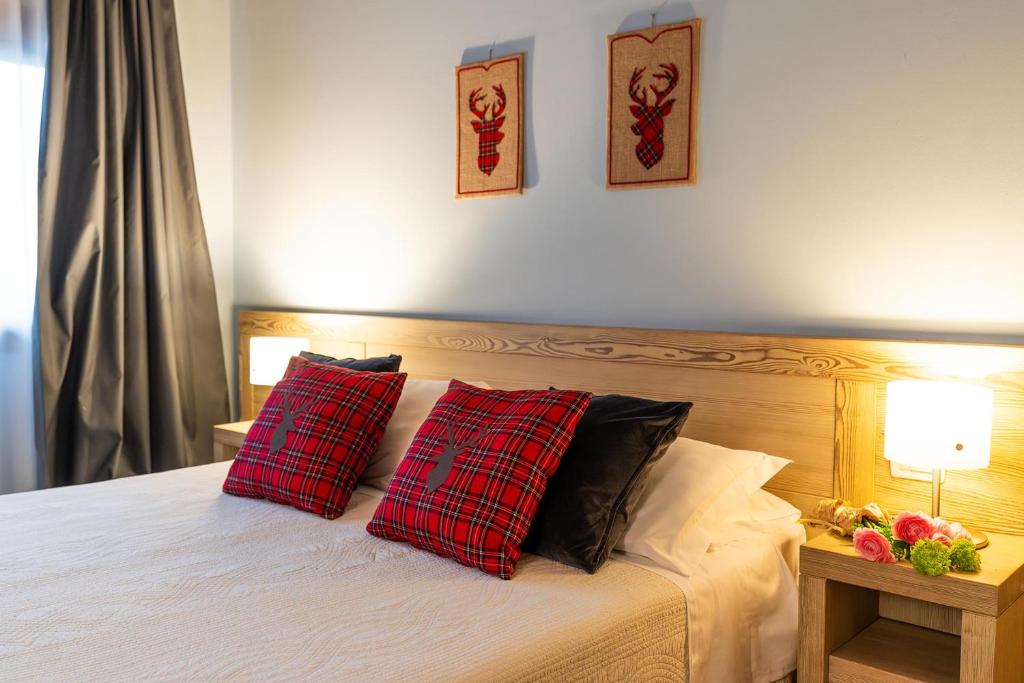 Łóżko lub łóżka w pokoju w obiekcie ACCADEMIA VINE LODGE