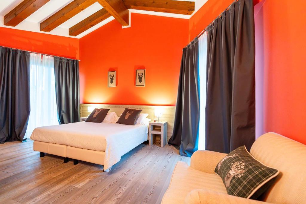 Łóżko lub łóżka w pokoju w obiekcie ACCADEMIA VINE LODGE