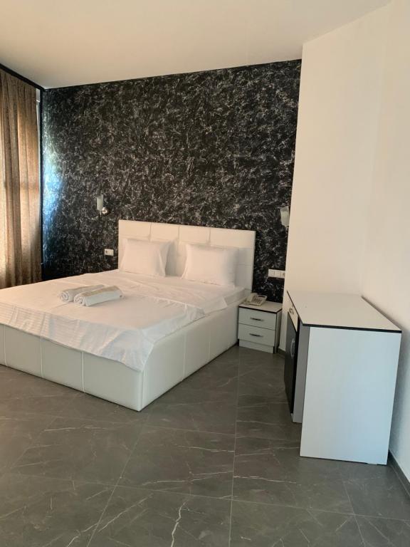 Postel nebo postele na pokoji v ubytování Hotel Albatros