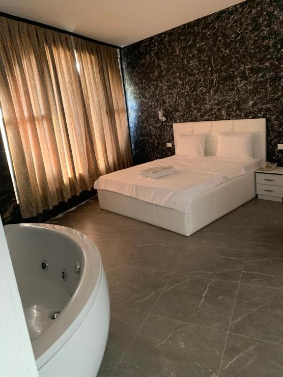 Postel nebo postele na pokoji v ubytování Hotel Albatros
