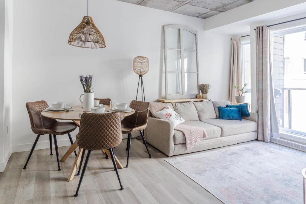a living room with a couch and a table at Northeka208 in Quebec City