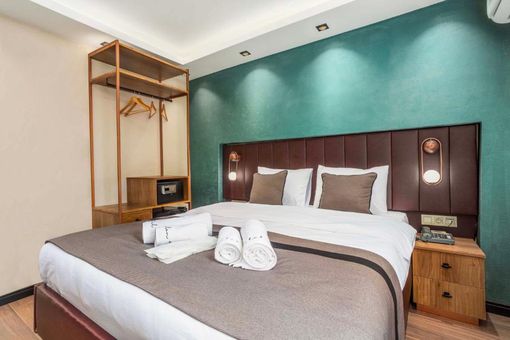 Postel nebo postele na pokoji v ubytování Marlon Hotel