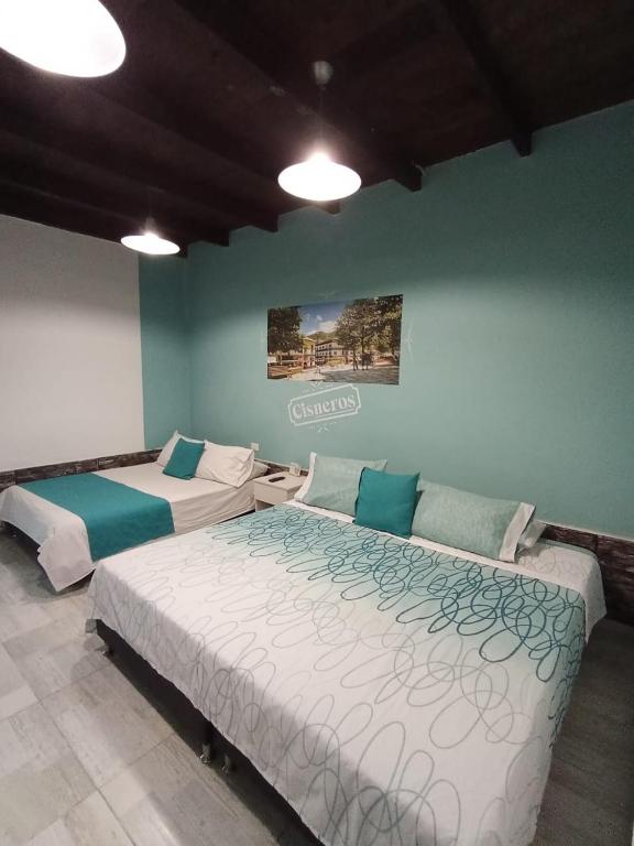 Postel nebo postele na pokoji v ubytování Almaviva Casa Hotel