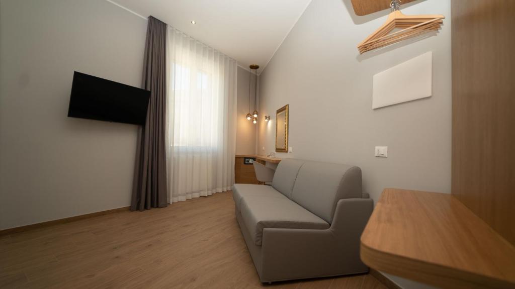 TV a/nebo společenská místnost v ubytování Manere Suites