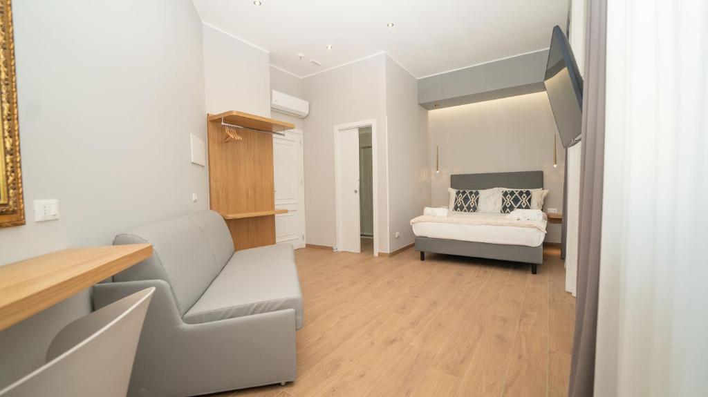 Postel nebo postele na pokoji v ubytování Manere Suites
